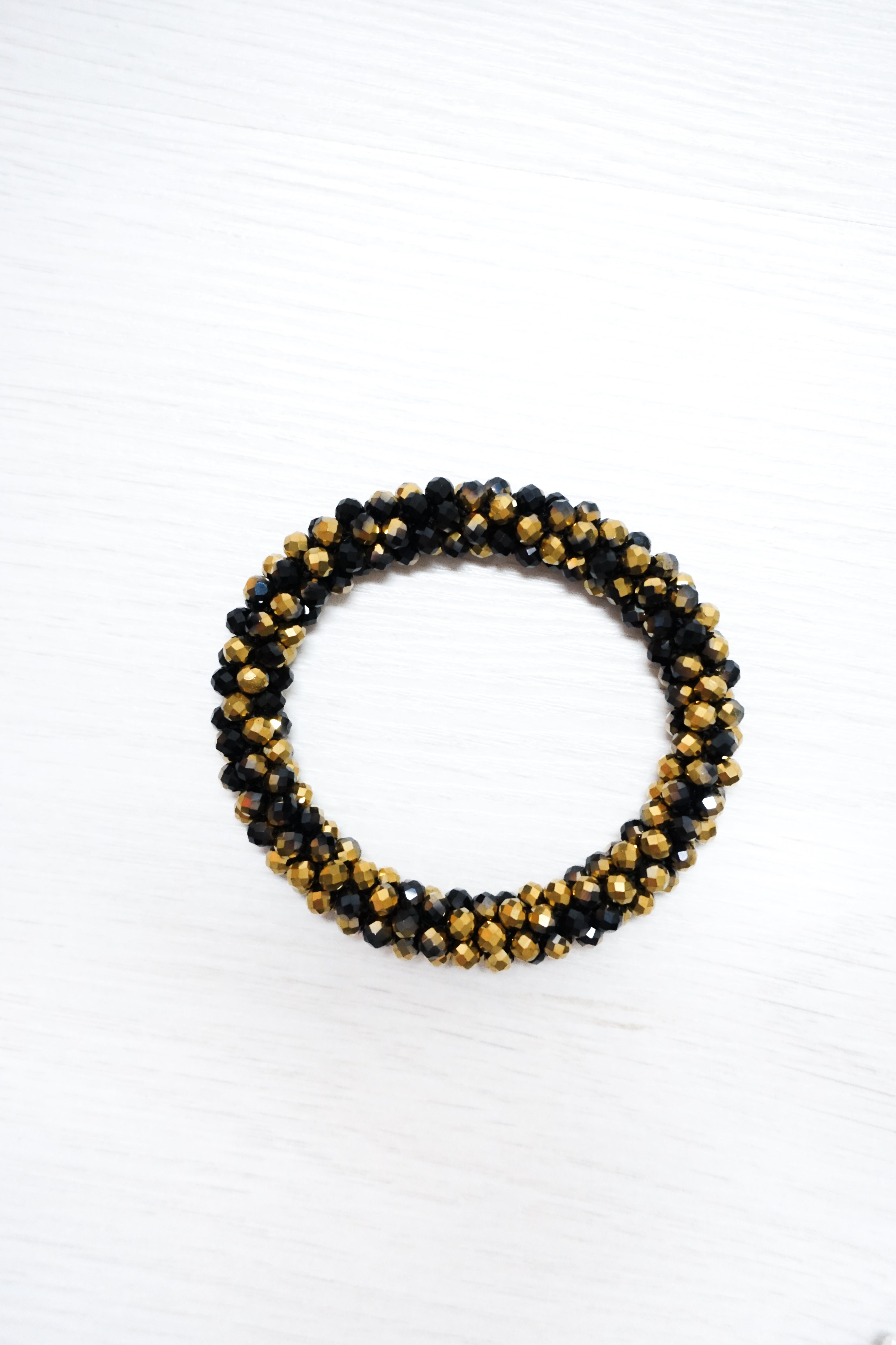 Perlenarmband schwarz/gold